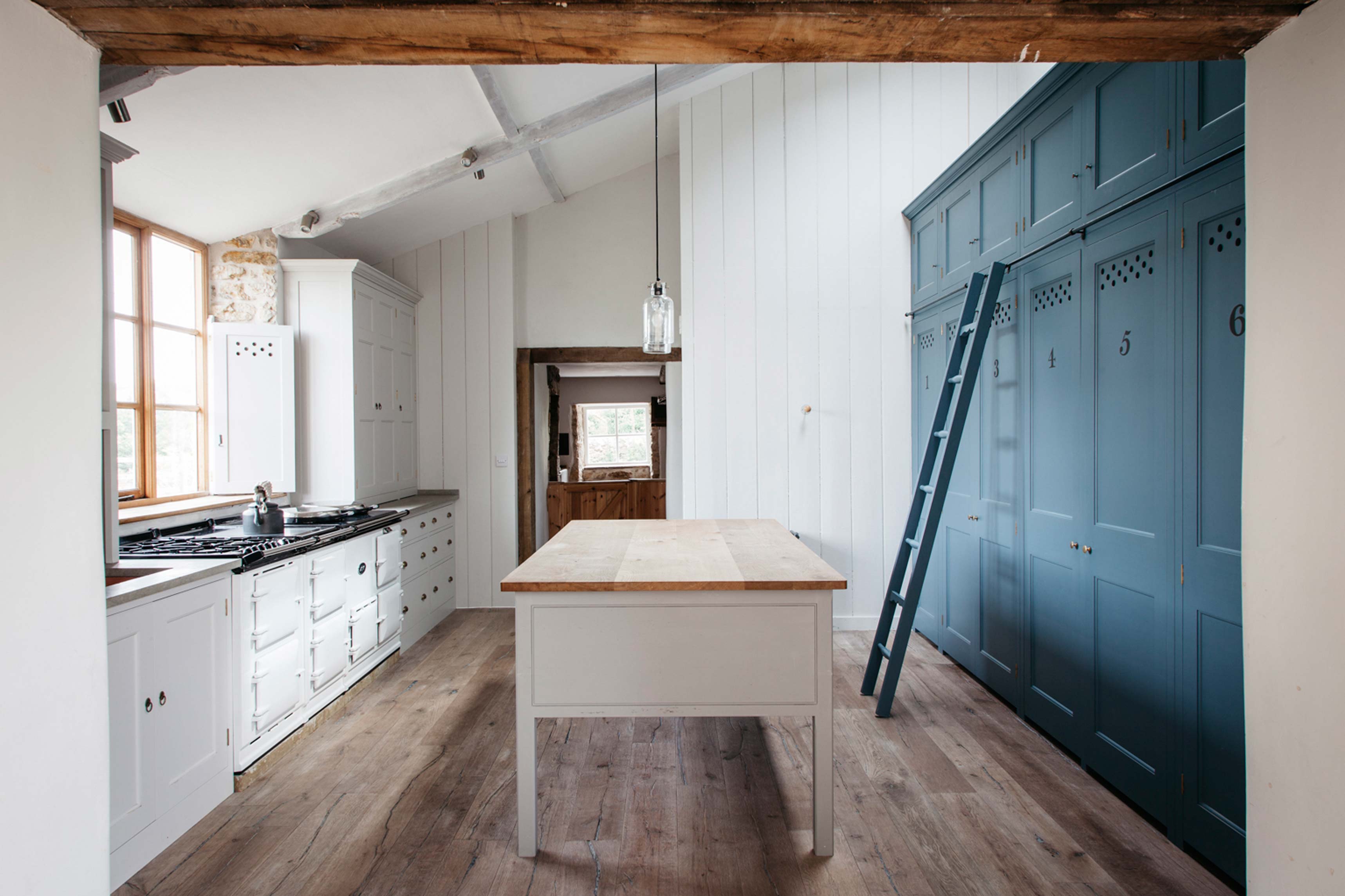  Kitchen with white Spitalfields cupboards and light blue cupboard with ladder