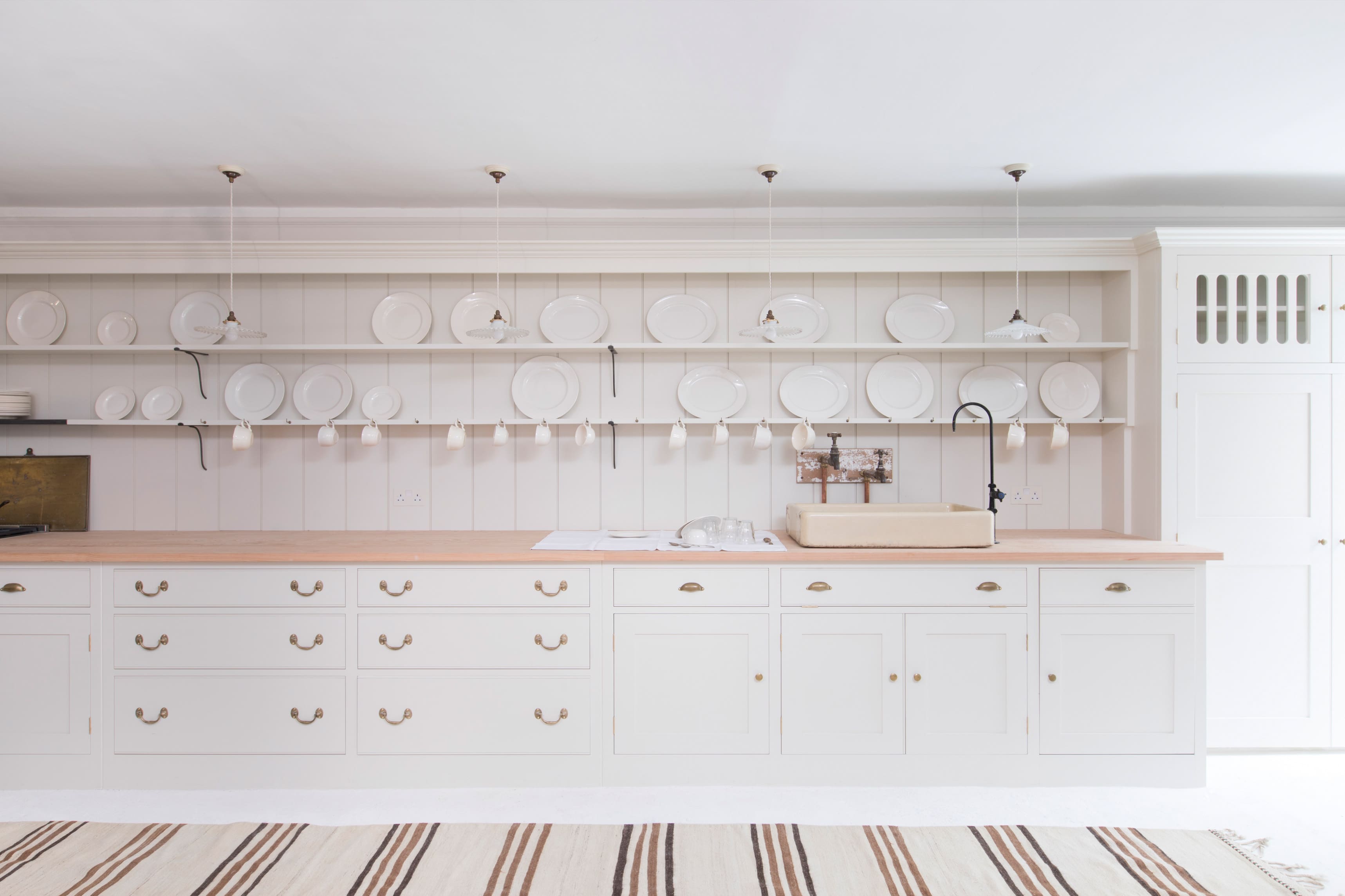  Cream kitchen with Wilkes doors, open dresser, and reclaimed pitch pine countertops