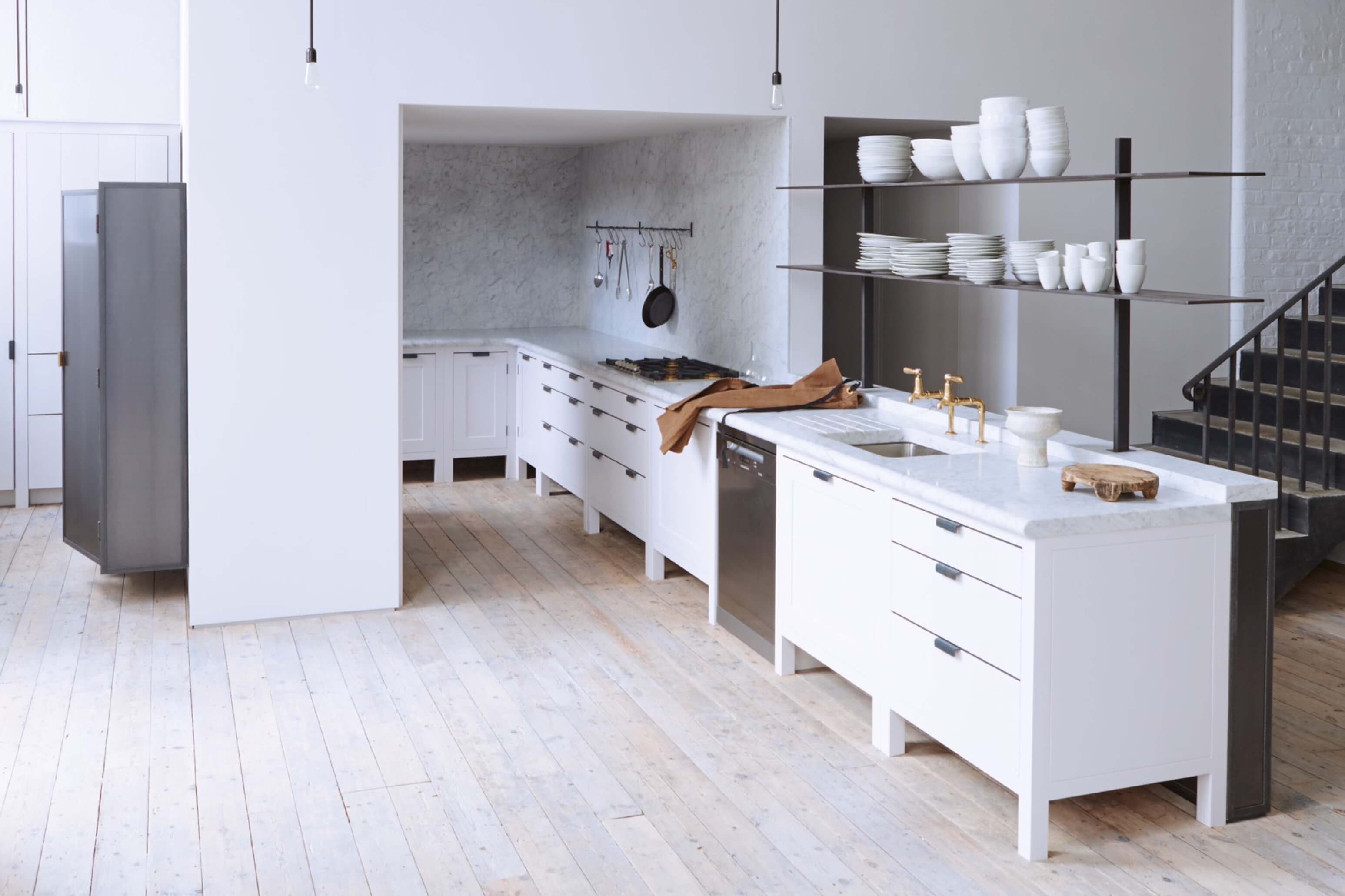  Open space white marble-clad kitchen designed by Plain English