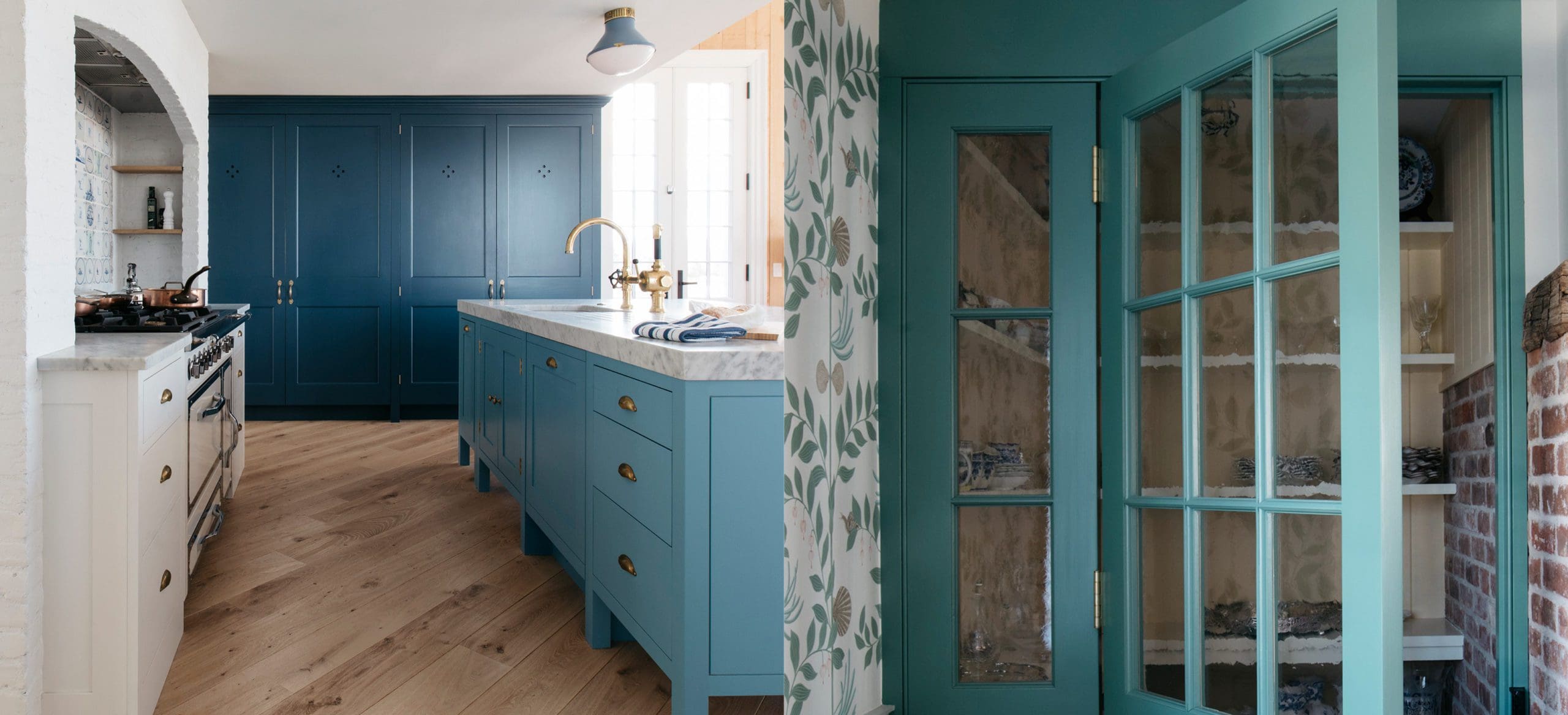  Dual view of kitchen with a blue island, brass hardware, navy cabinets, and turquoise glazed pantry door.