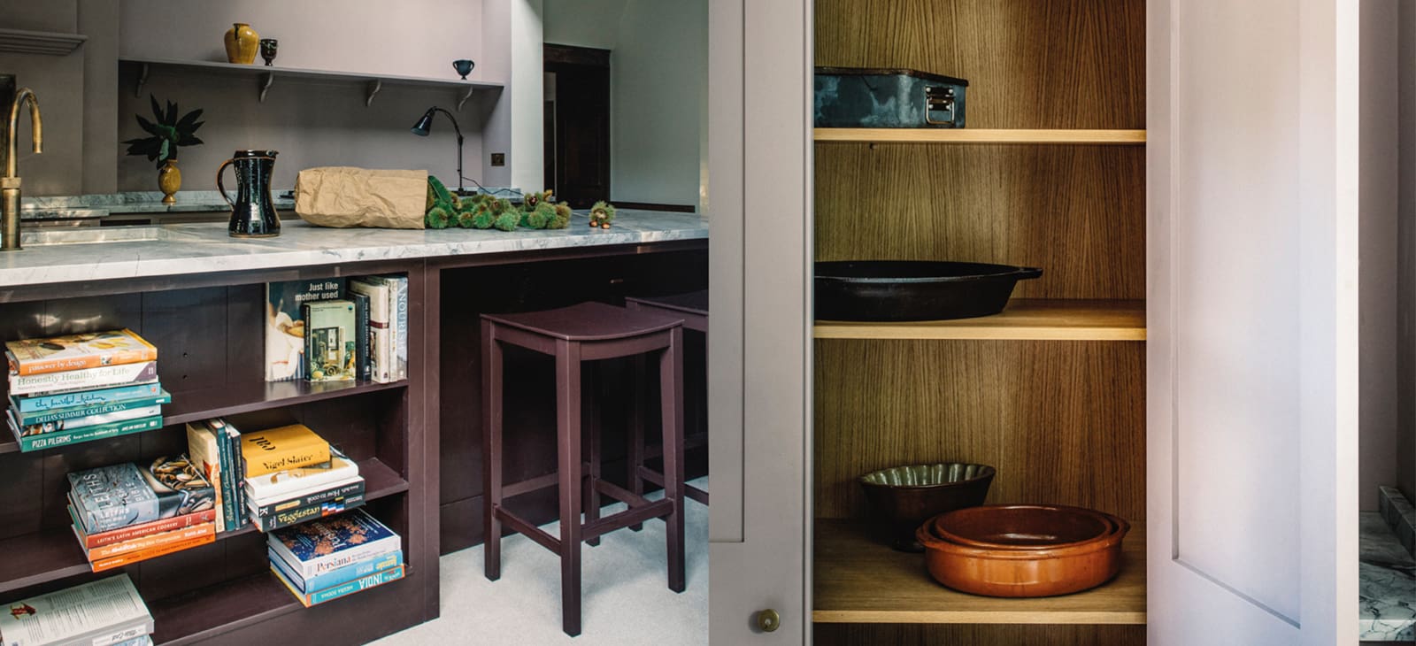  Close-up of a custom kitchen in the North Hill project, highlighting the bespoke cabinetry and intricate design details, such as custom handles and built-in shelving.