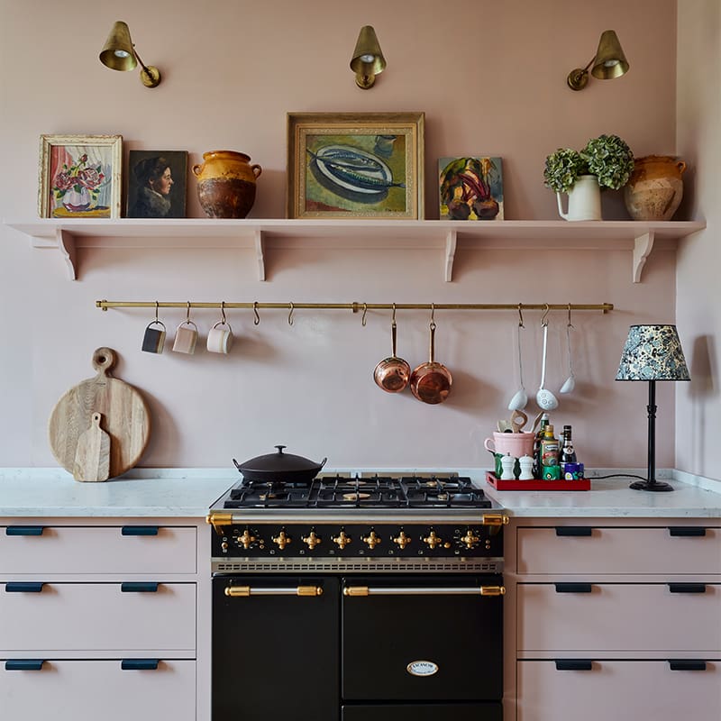 Bespoke kitchen design, featuring a back oven and stove surrounded by custom drawers.