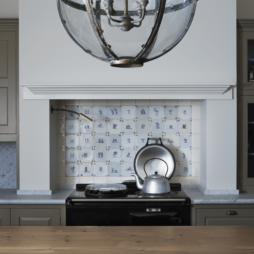 Close up of the Plain English New York City showroom, featuring custom black cabinets with gold accents.