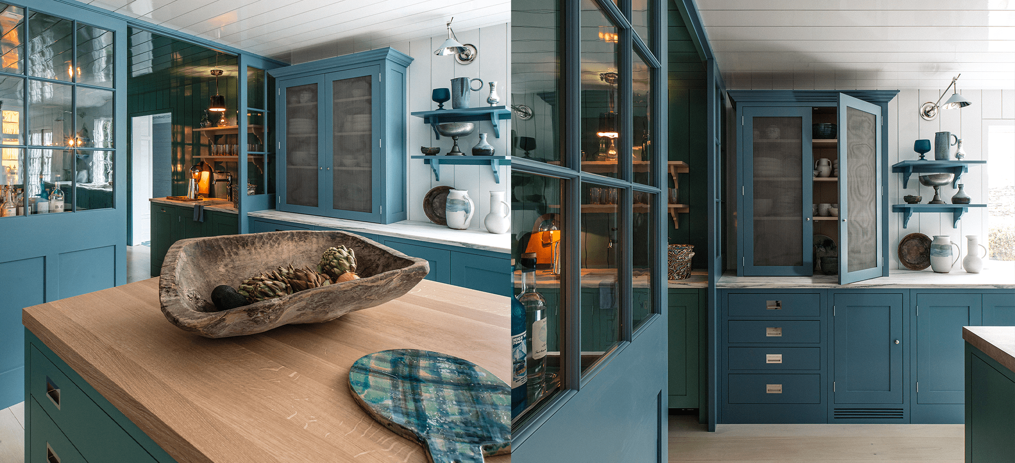  Bespoke cabinetry in teal with glass-fronted doors, custom shelving, and a wooden countertop.