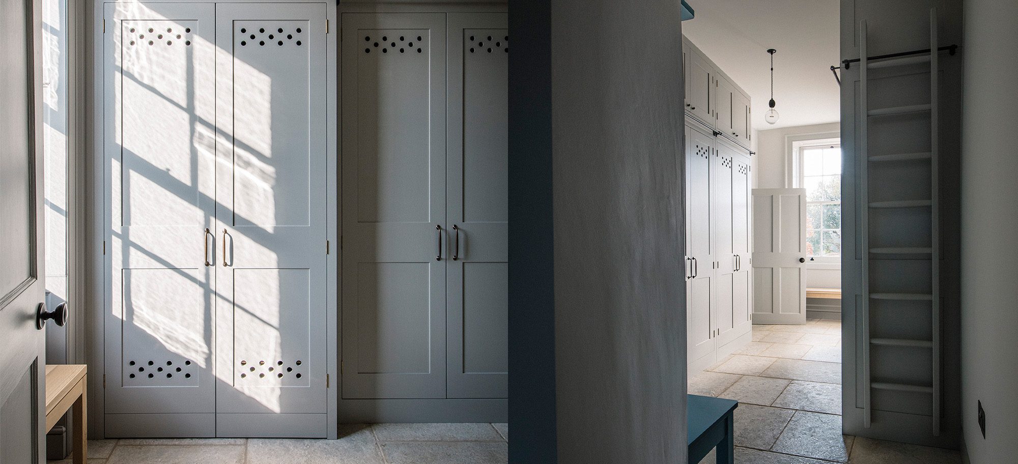  Bespoke cabinetry in soft gray with custom perforated detailing, featuring tall cupboards and elegant handles.