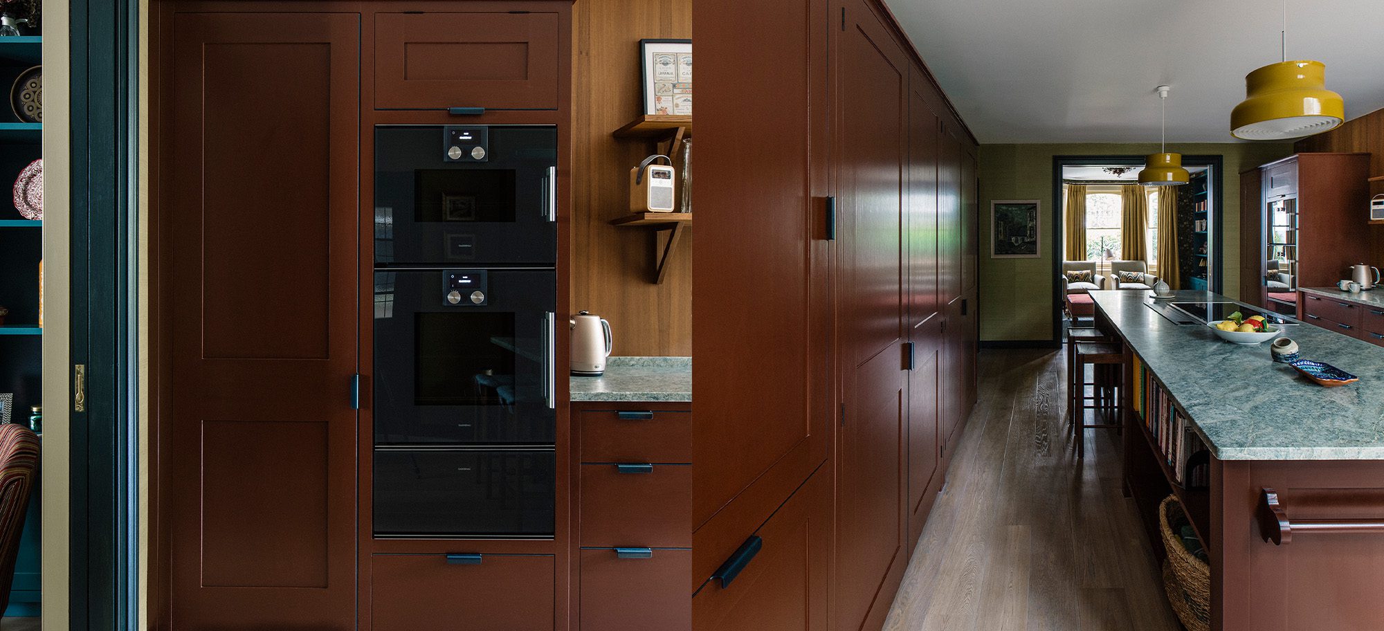  Custom cabinets in rich brown with custom black appliances and a sleek green countertop.