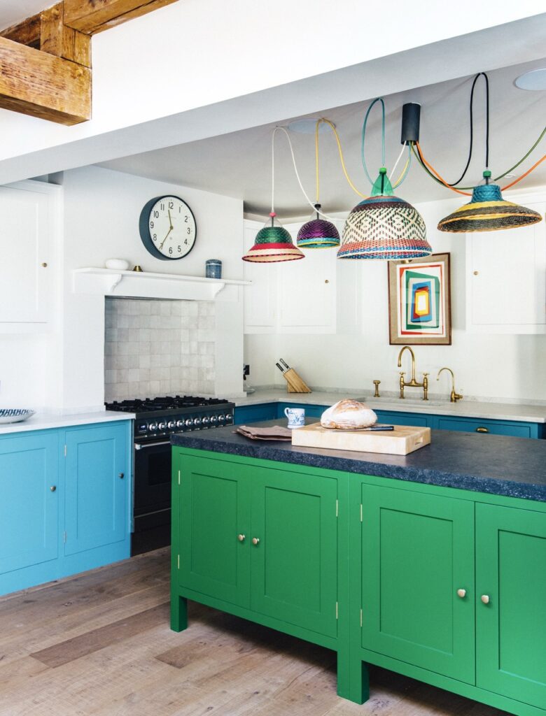 Floor cupboard painted in a light blue with kitchen island painted in Pickle green and white top cabinets